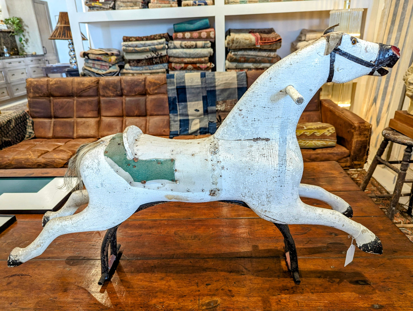 horse on steel stand, glass eyes, Swad ears, felt around seating. Real Heir tail.
