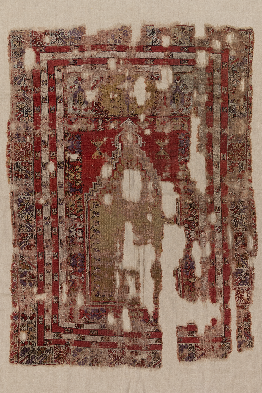 Antique Anatolian Rug Fragment on Linen
