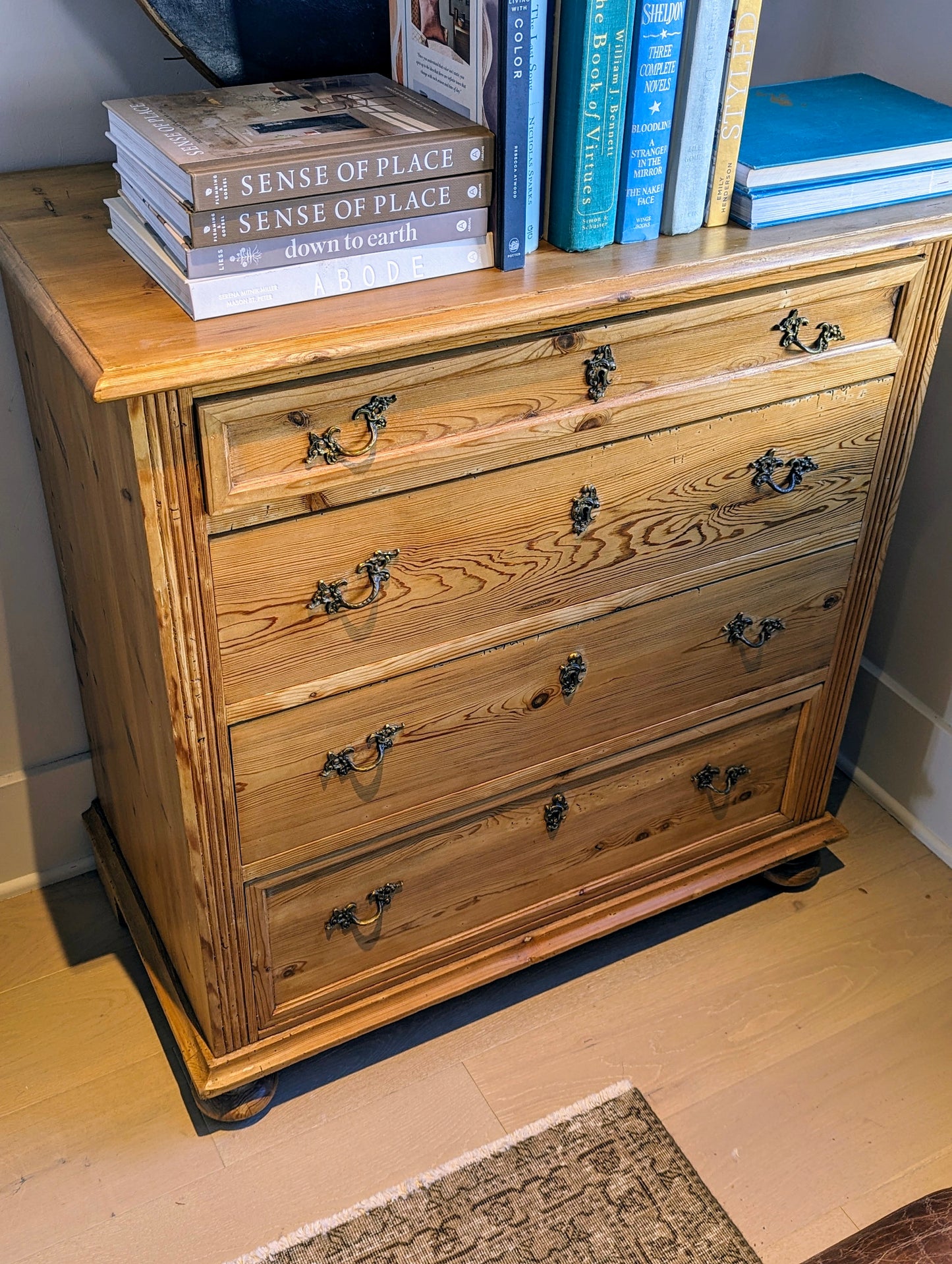 Pine chest of drawers with flutted side pilasters.