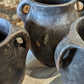 Set of three blacken ceramic pots